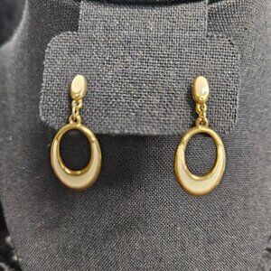Gold tone drop earrings with cream enamel color